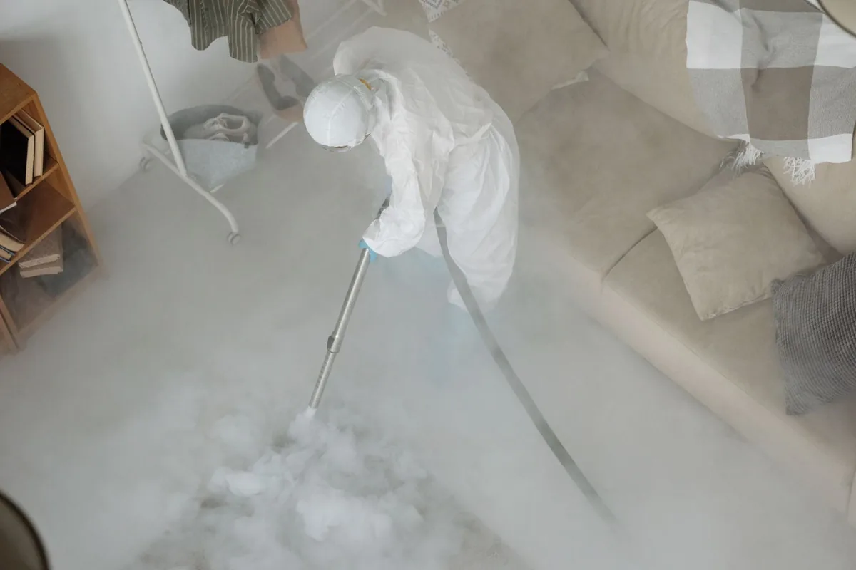 Biohazard cleanup technician in protective equipment, Addams, Long Beach, CA